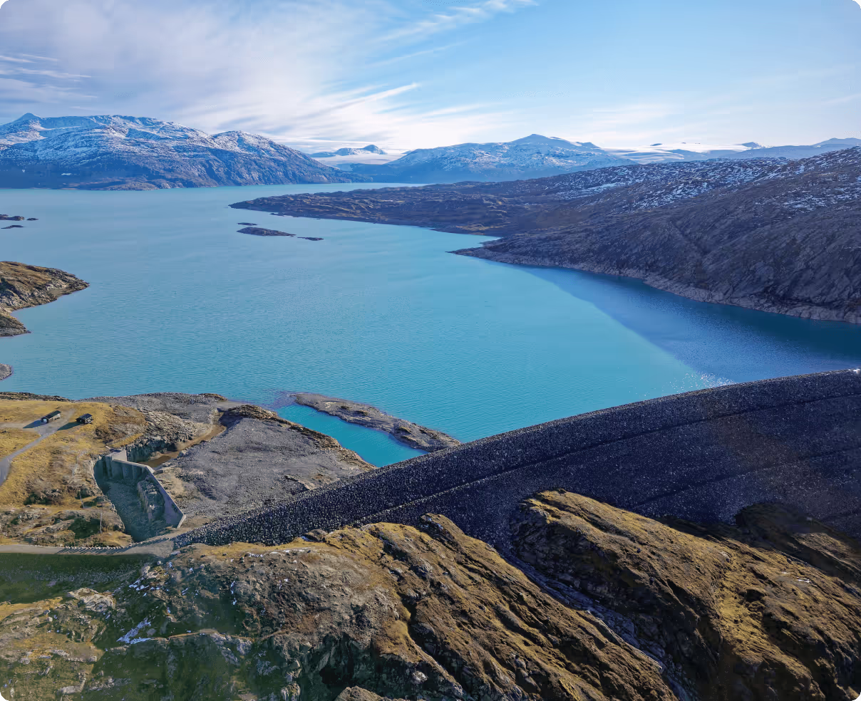 The hydropower dam and reservoir at Glomfjord, surrounded by mountains.